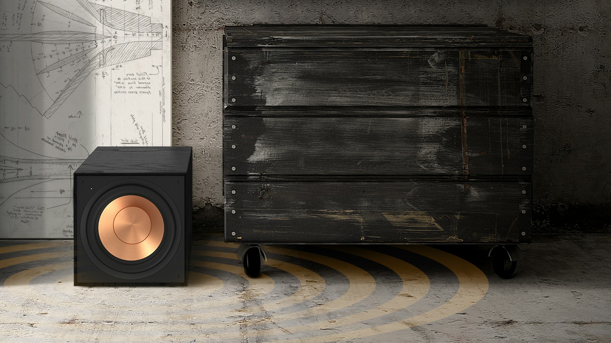 Reference Subwoofer R-101SW next to a black dresser